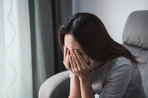 One image depicts a seated woman, visibly distressed, holding her face in her hands. Her expression and body language suggest a state of deep sadness or grief